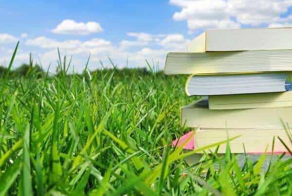 books in grass crop