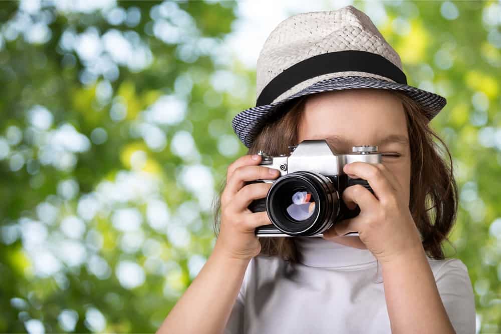 Girl taking photo with camera