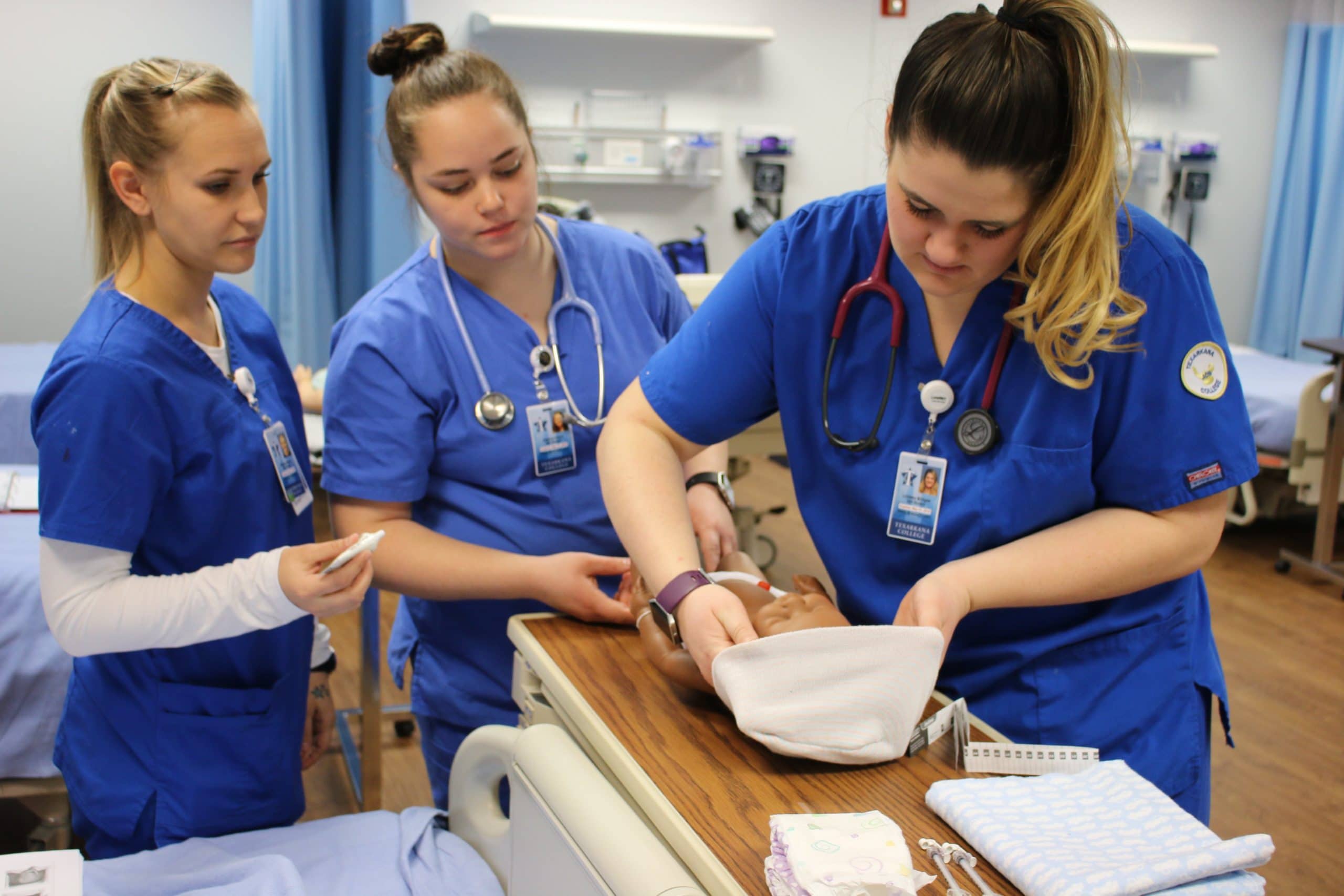Texarkana College students learning nursing techniques in our LVN program.