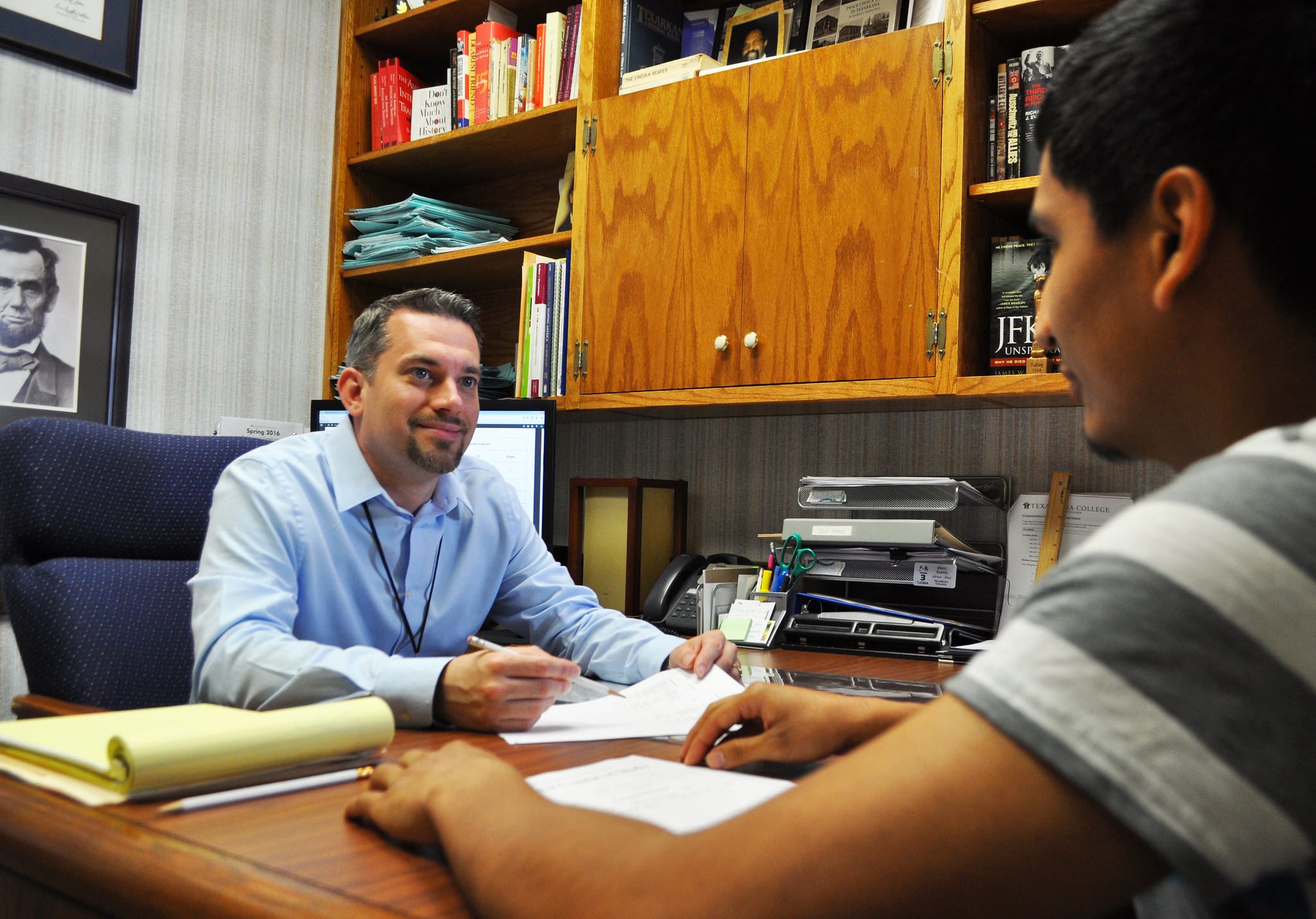 Student and advisor discussing an upcoming schedule