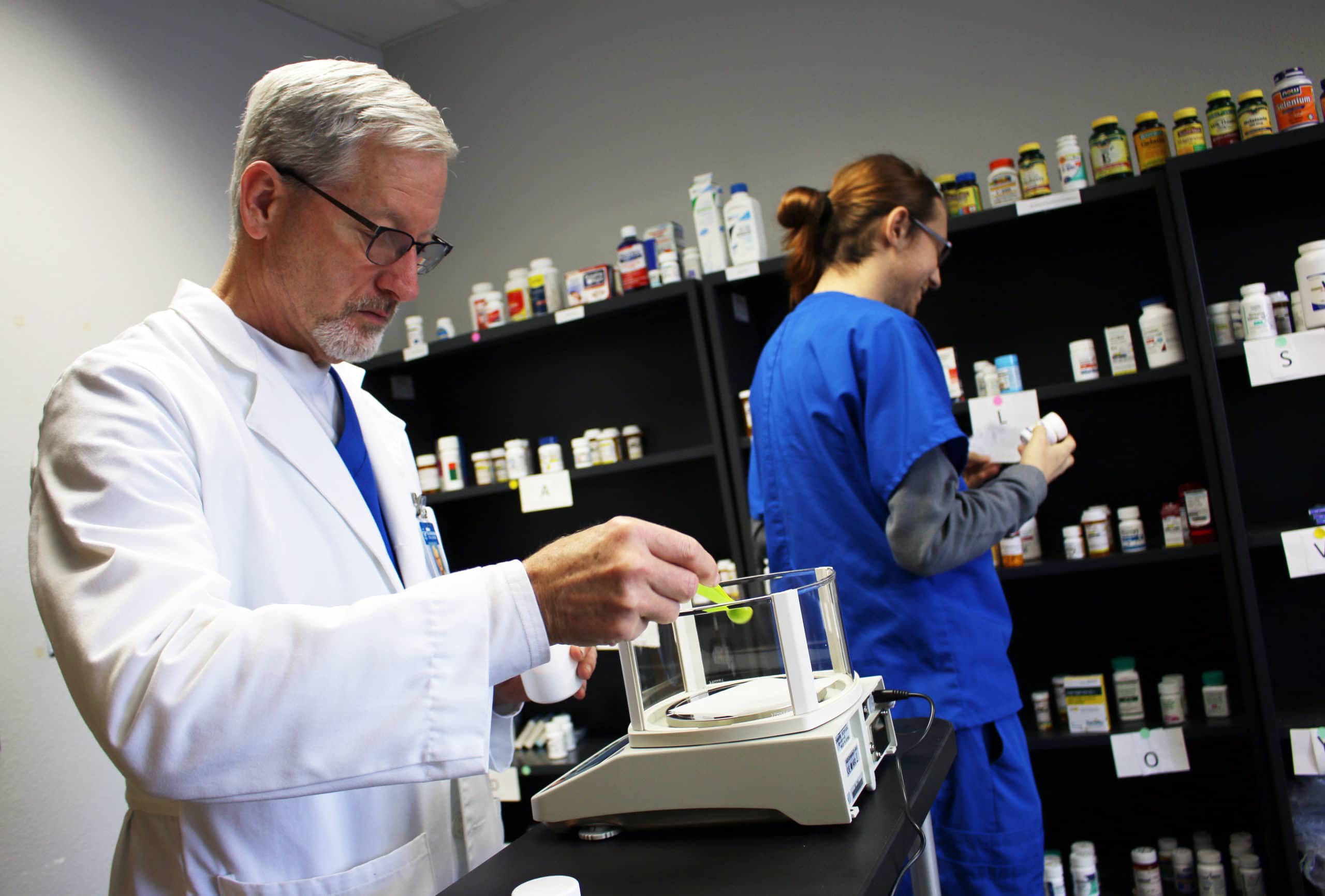 With a pharmacy technician degree, a technologist works in tandem with a pharmacist.