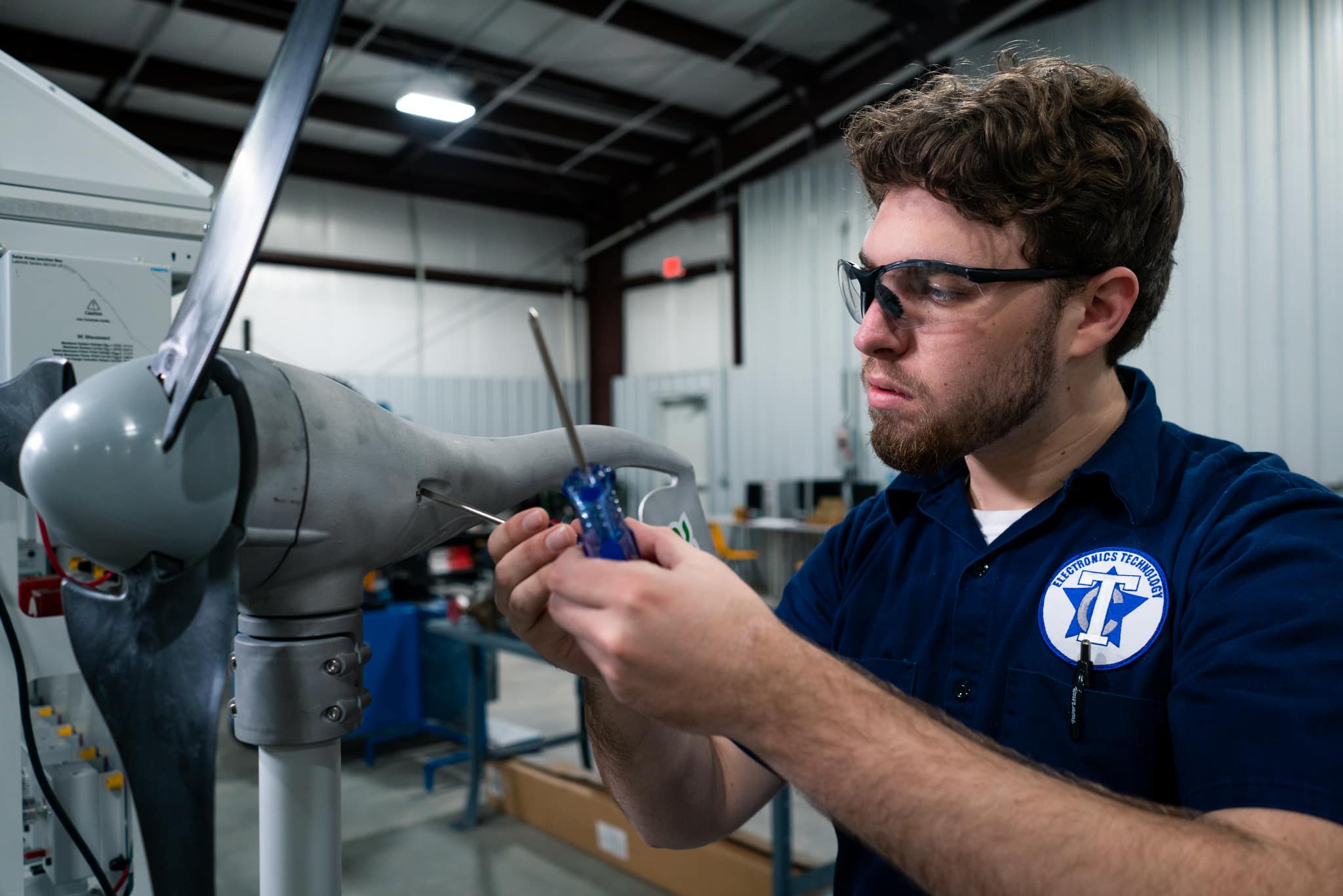 Mechatronics degree student working in lab