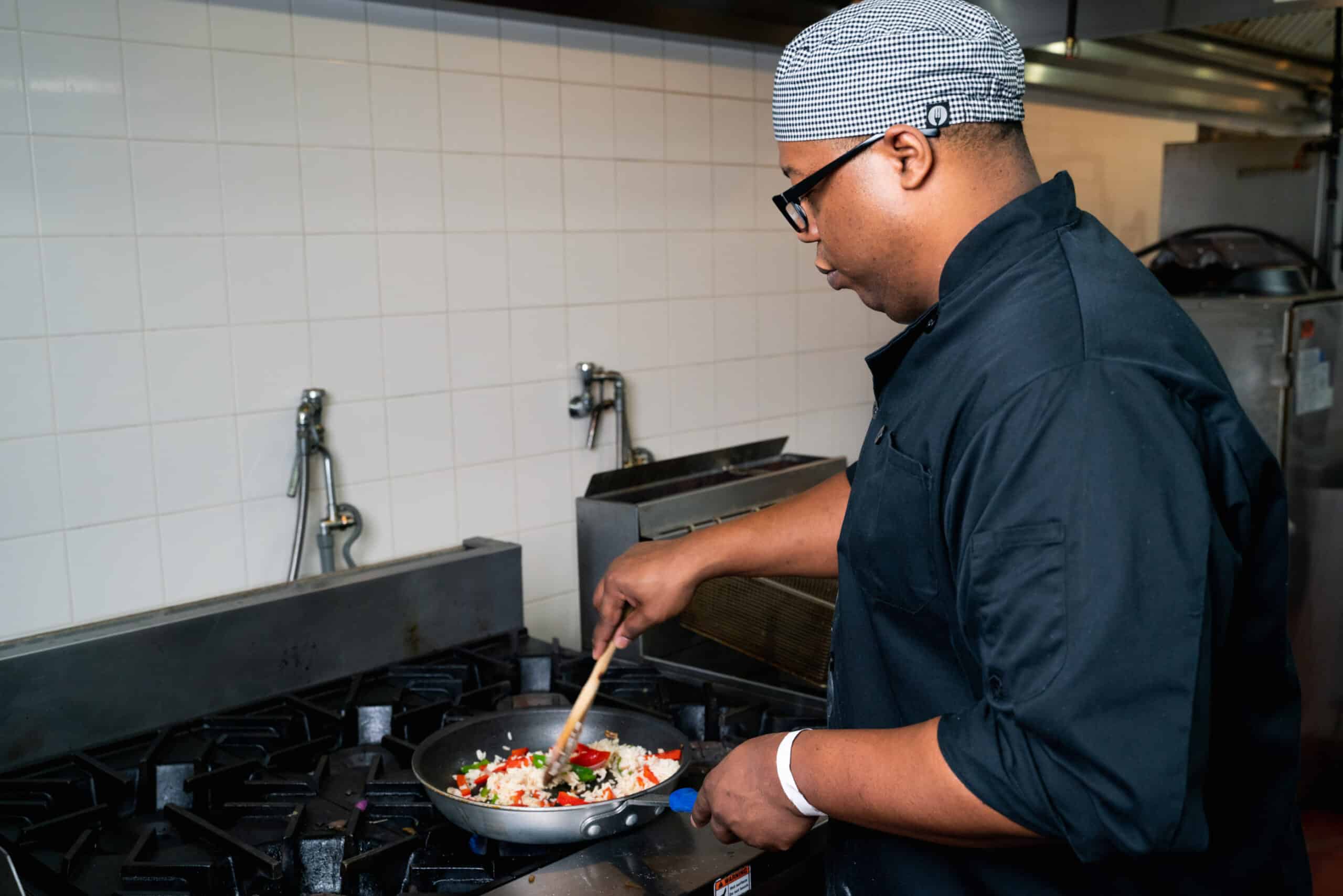 Culinary Arts program student working on a sauté