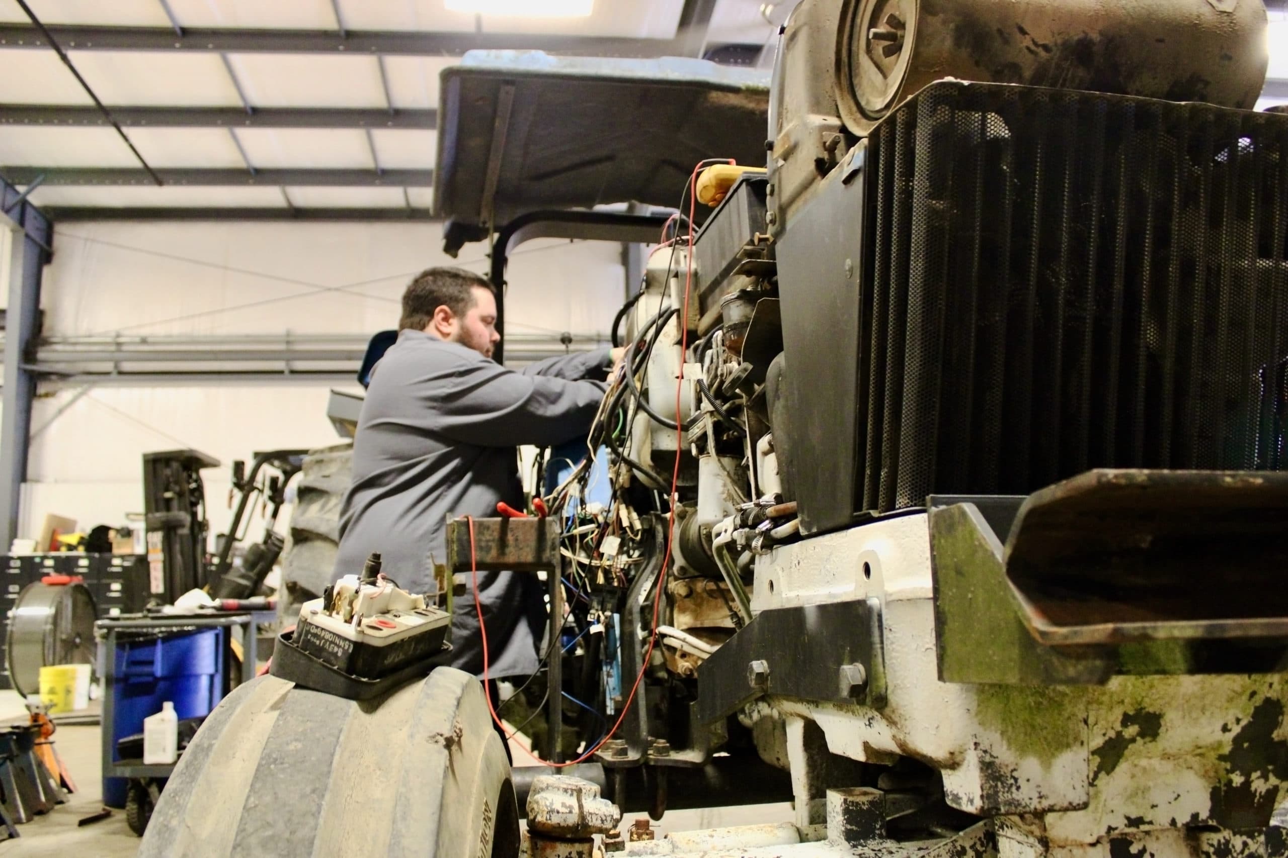 Student working on an engine in diesel mechanic school in Texarkana, Texas.