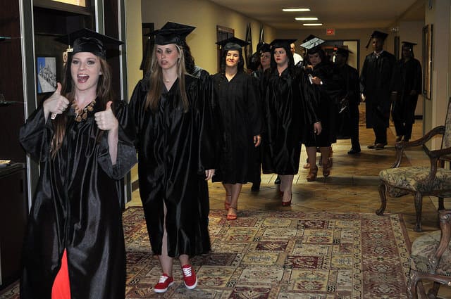 Graduates walking to auditorium
