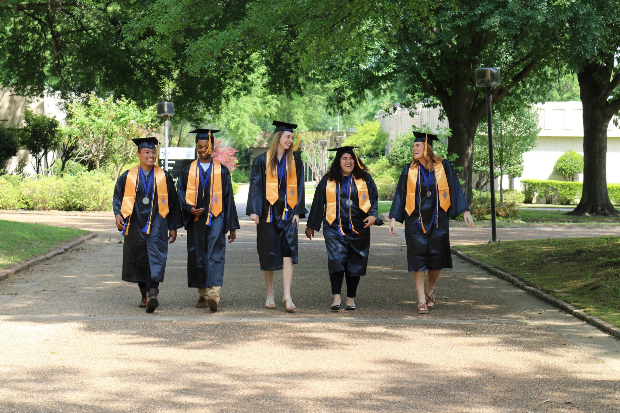 Graduates walking on campus