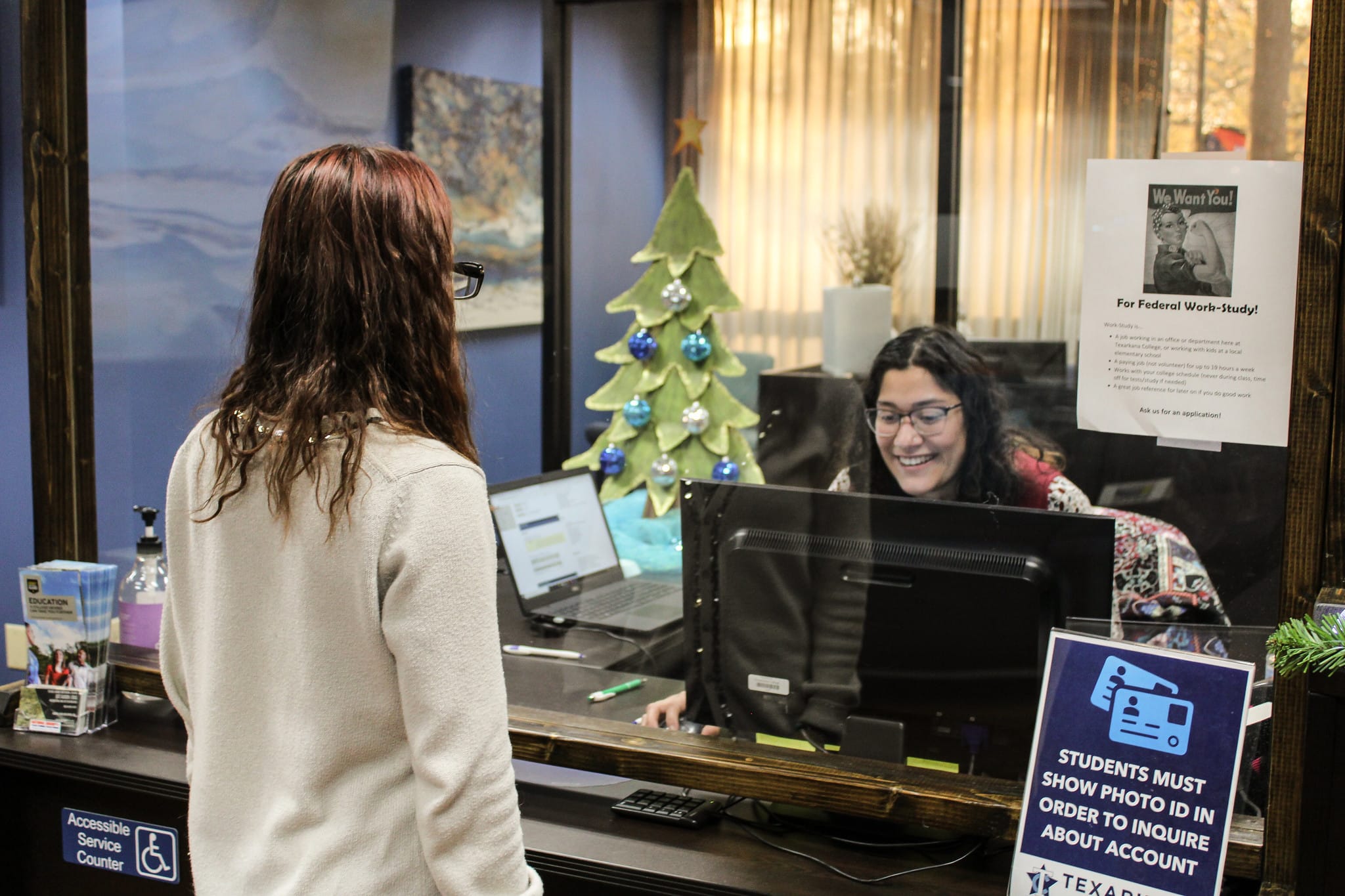 Financial Aid student worker greets visitor
