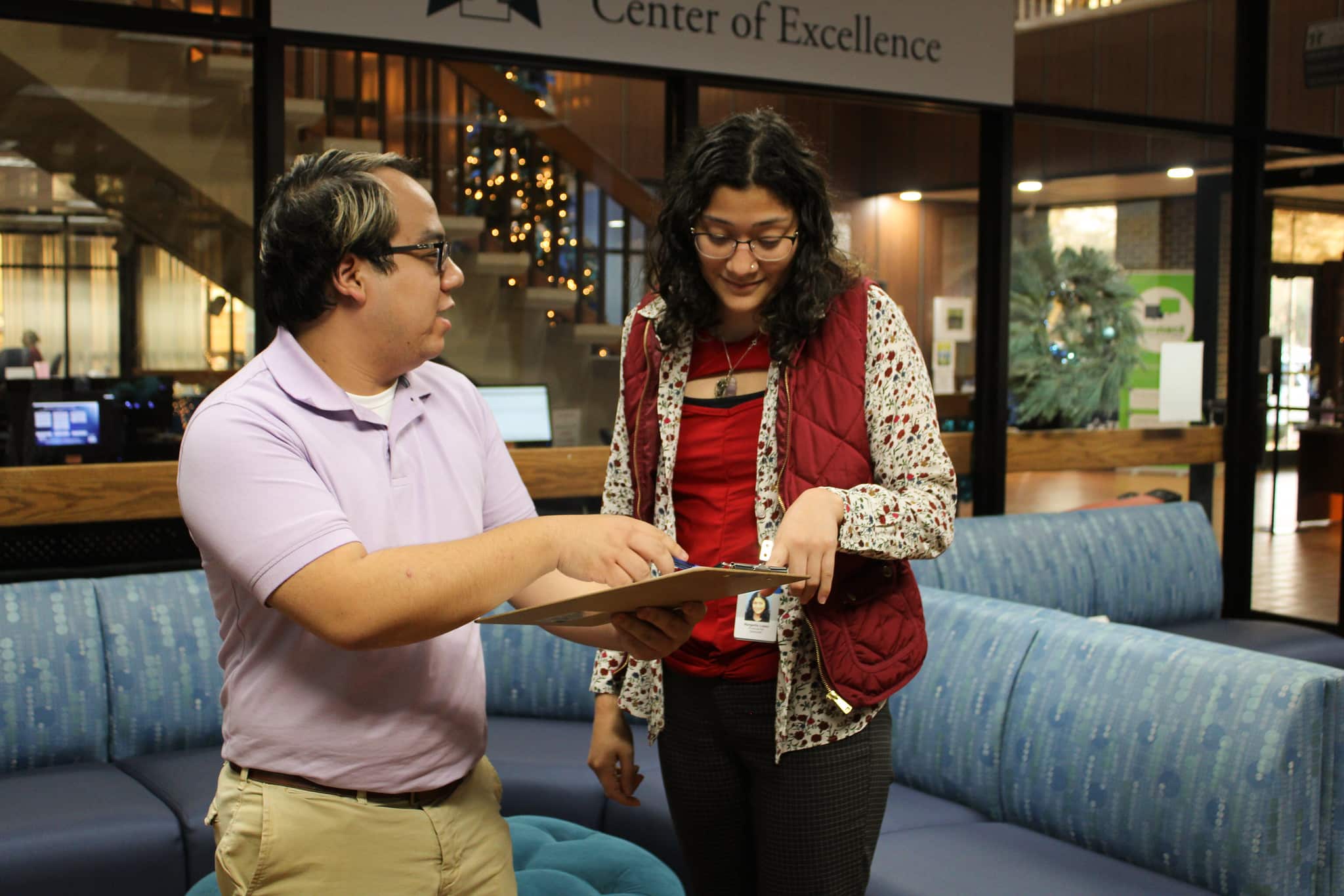 Financial Aid staff discuss paperwork