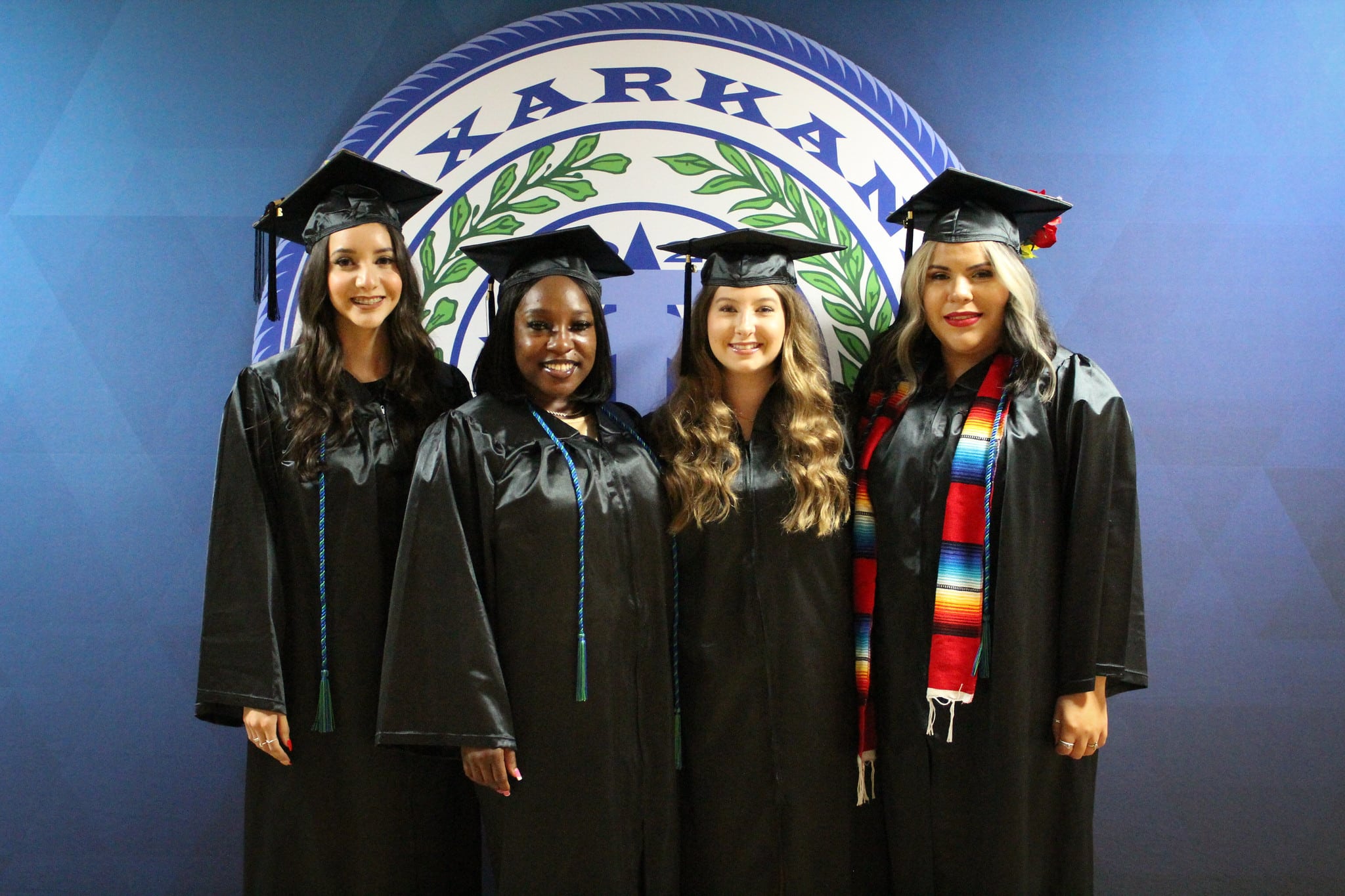 Four Fall 2021 graduates pose for a photo