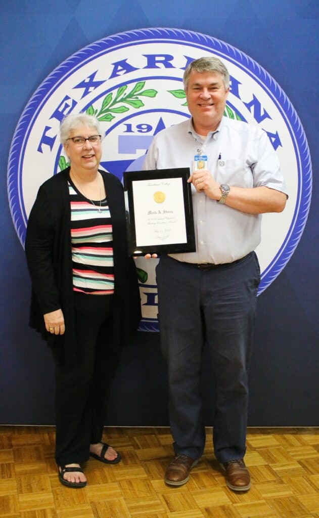 NANCY LYN STOREY AND MARK STOREY receiving Texarkana College’s Endowed Chair for Teaching Excellence Award (2021-2022) on May 11, 2022, at TC’s Spring Awards Ceremony. 