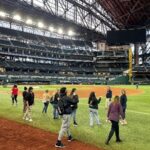 Students on a field trip visiting a baseball stadium
